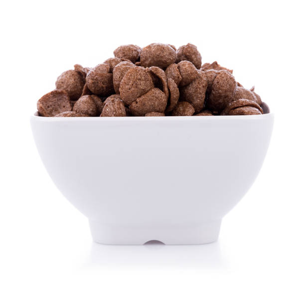 istock chocolate cereals in white bowl on white background. Cornflakes 857044860