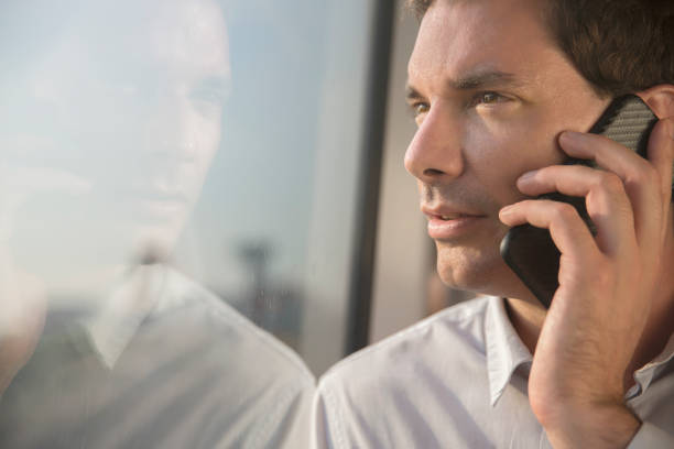 istock Businessman on the phone whilst travelling by train 857048492