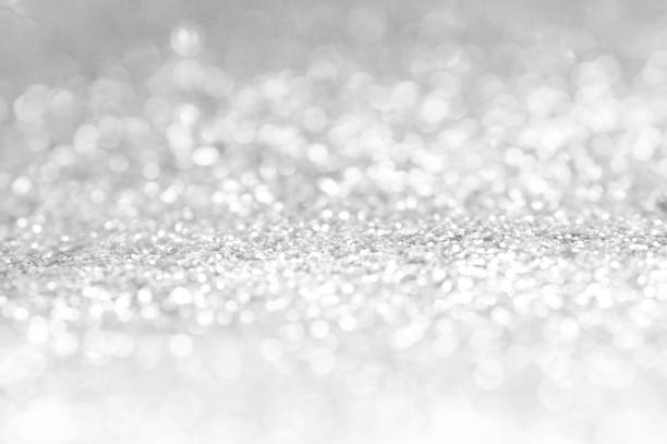 istock white and gray Sparkling bokeh background 857049364