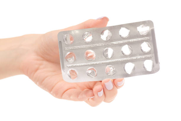 istock Female hand empty packing from pills medicine 857052382