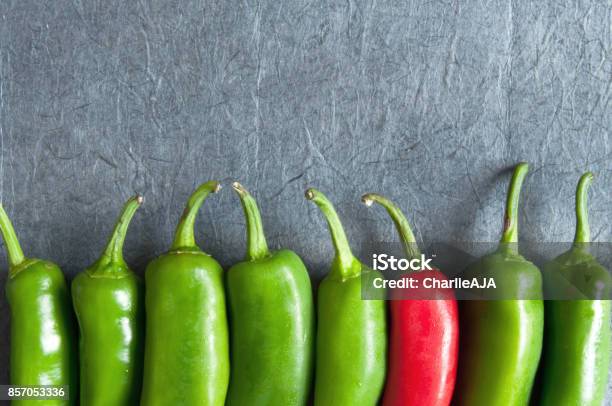 Chilli Peppers Stock Photo - Download Image Now - Standing Out From The Crowd, Individuality, Advertisement