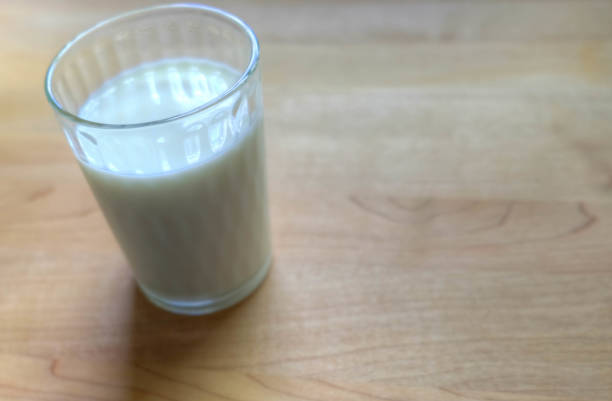 istock A glass of milk on a wood table 857053364