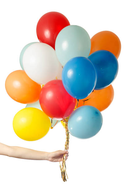 istock Female hand holding air colored balls isolated 857056570