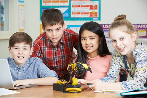istock Portrait Of Pupils In Science Lesson Studying Robotics 857056638