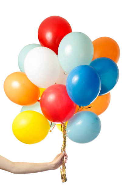 istock Female hand holding air colored balls isolated 857057086
