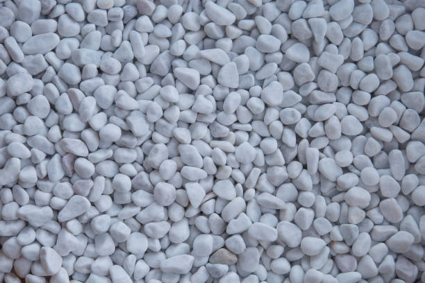 istock White pebbles texture or background. White gravel background. 857057288