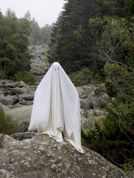 istock Scary ghost standing in the middle of a stone river 857059524