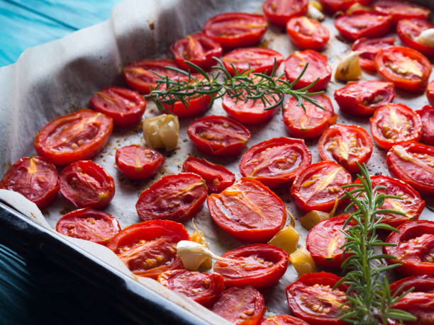 istock Red heirloom tomatoes baked with garlic 857069110