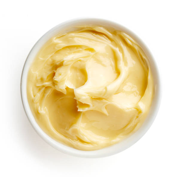 istock Bowl of butter isolated on white background, top view 857074938