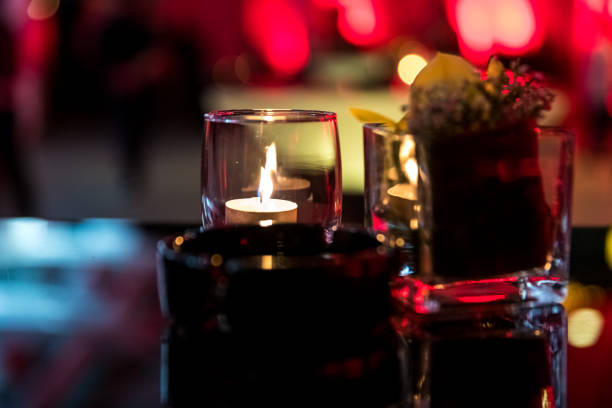 istock Burning candle in glass cup with abstract background 857074986