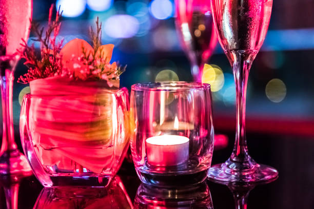 istock Burning candle in glass cup with abstract background 857077996