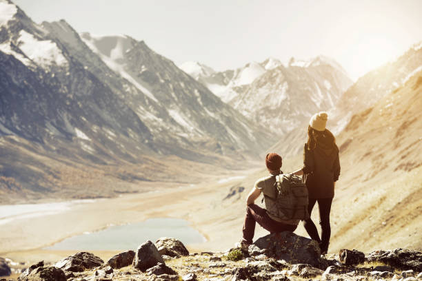 istock Couple trekking travel mountains concept 857079564
