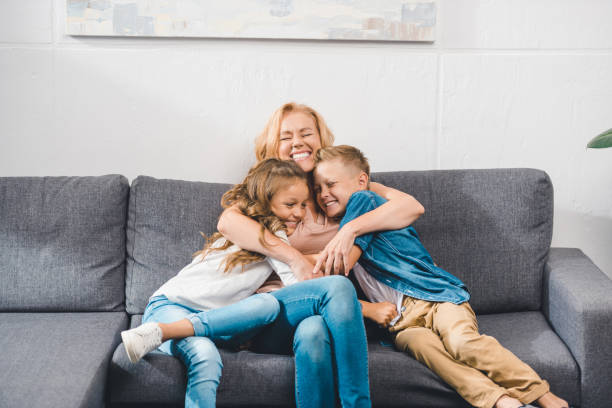 istock grandmother embracing her grandchildren 857081800