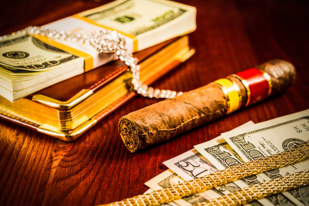 Cuban cigars in the cigar box on a light wooden background