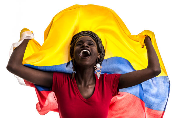 колумбийский / эквадорский / венесуэльский вентилятор празднования с национальным флагом - colombian ethnicity стоковые фото и изображения