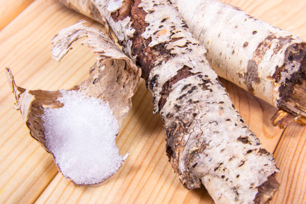 istock Xylitol - sugar substitute. Birch sugar on wooden background. 857087034