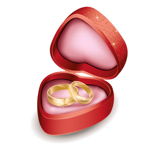 Wedding rings in red box at shape of heart Wedding rings in red box at shape of heart diamond ring clipart stock illustrations