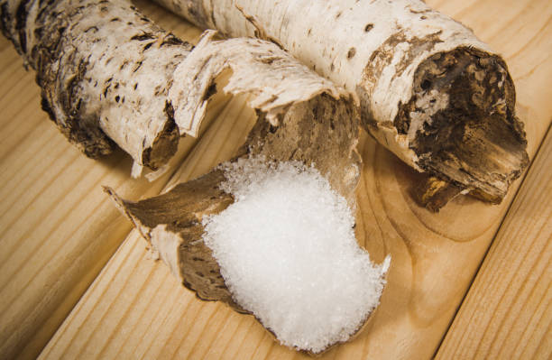 istock Xylitol - sugar substitute. Birch sugar on wooden background. 857090680