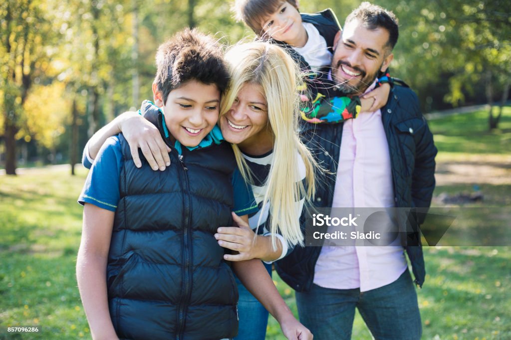 Happy family always together Mixed-race family enjoying in public park Family Stock Photo