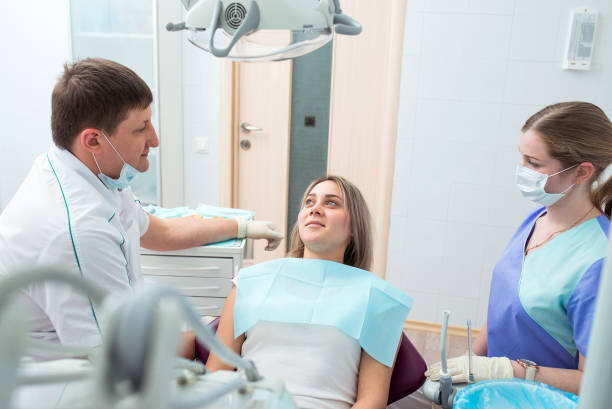 istock Dentist, patient and assistant at dental clinic. 857098948