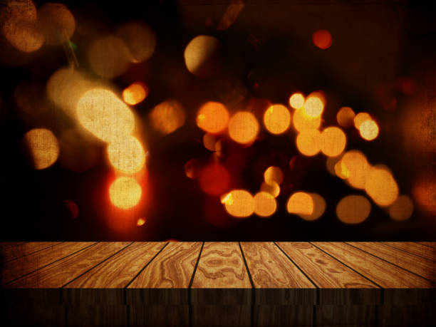 istock Grunge style background with wooden table against bokeh lights background 857100064