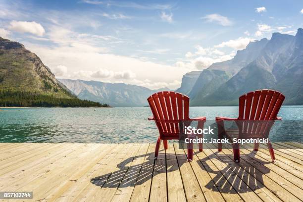 Jetty With Chairs By Minnewanka Lake Alberta Canada Stock Photo - Download Image Now