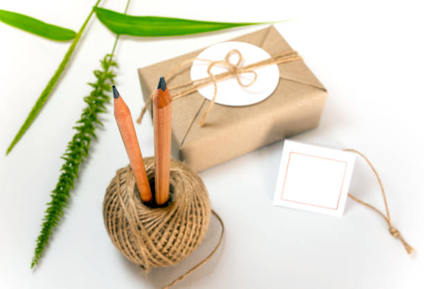 istock Gift box wrapped in brownpaper and rustic hemp as natural rustic style 857107588