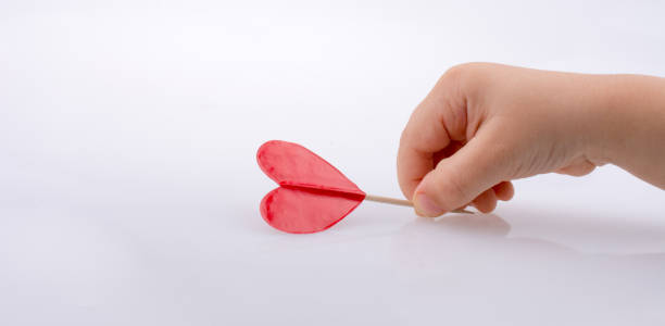 istock Little red color heart shape in hand 857121854
