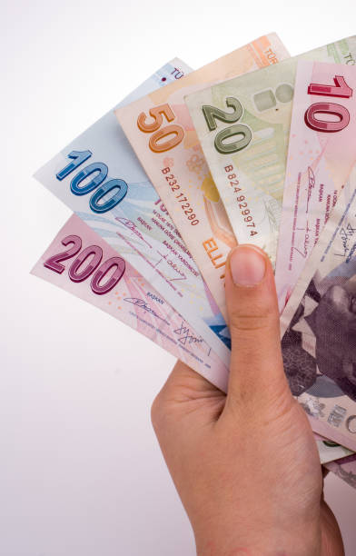 istock Hand holding Turksh Lira banknotes  in hand 857121888