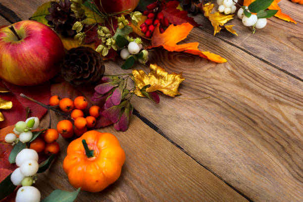 istock Thanksgiving background with orange pumpkin and golden maple leaves 857122532