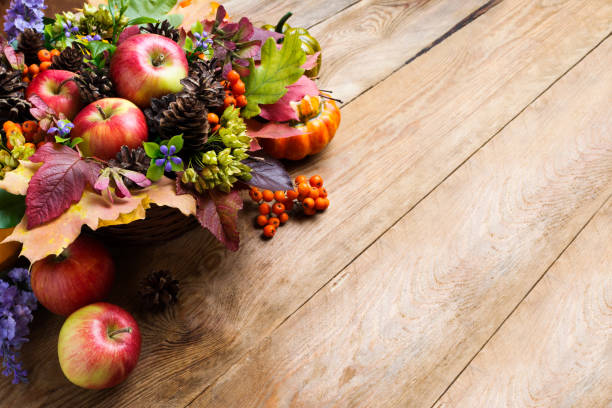 istock Thanksgiving apples, cones and blue flowers arrangement 857122594