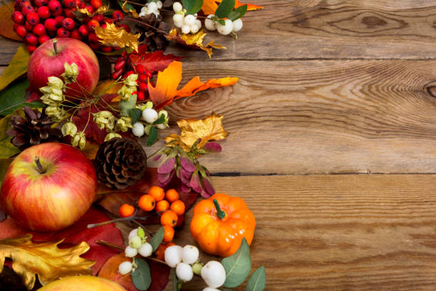 istock Thanksgiving background with apples, golden maple and oak leaves 857122624
