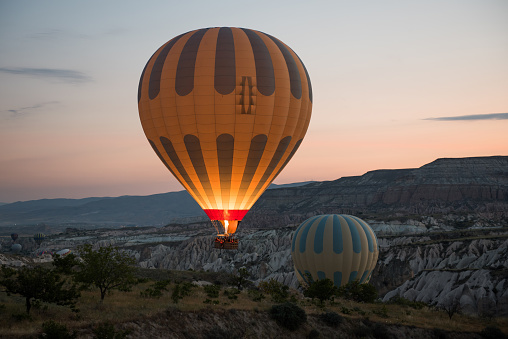 Hot air balloons flying on sunrise