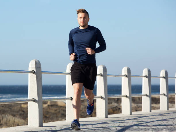 istock healthy young man going for a run outside 857125800