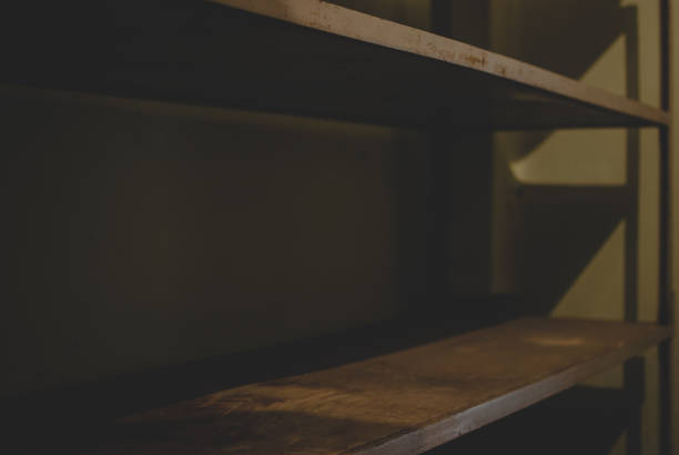 istock Empty metal shelves covered with rust in the storage 857133142