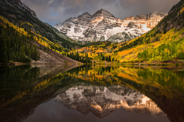 istock First morning light touching Rockie mountain at Maroon bell 857134404