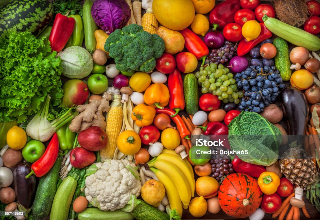 Vegetables and fruits large overhead mix group on colorful background Vegetables and fruits large overhead mix group on colorful background in studio Vegetable Stock Photo
