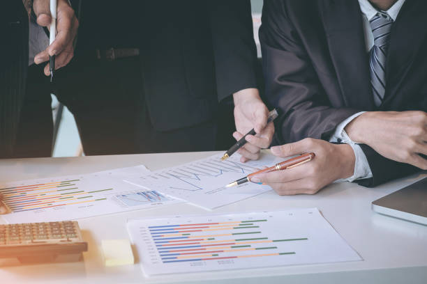 istock Business team colleagues discussing new plan financial graph data on office table with laptop and digital tablet. 857145938