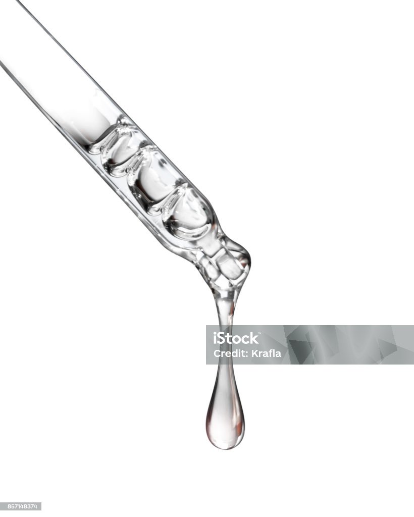 Cosmetic pipette with a drop close up on white background Pipette Stock Photo