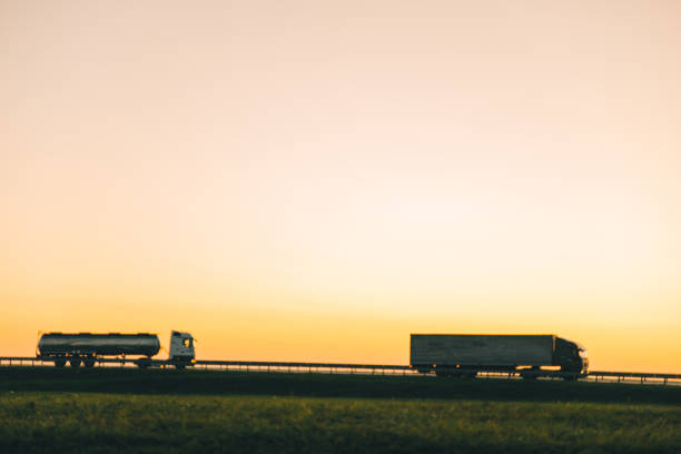 istock truck on highway on sunset 857149428