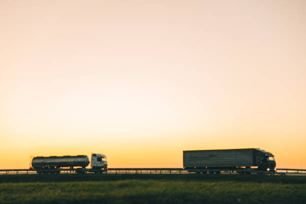 istock truck on highway on sunset 857149818