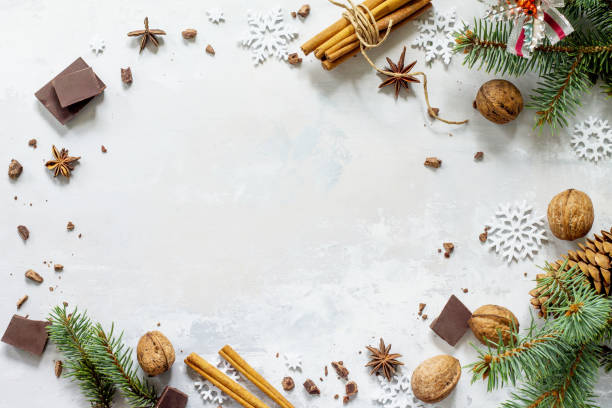istock Ingredients for Christmas baking - chocolate, cinnamon, anise and nuts on a stone or slate background. Seasonal, food background. 857156360