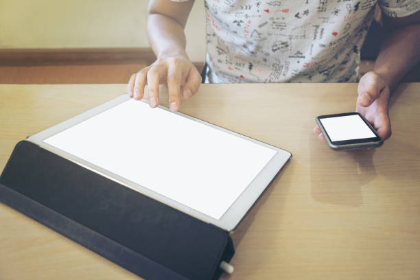 istock Close-up of businessman using tablet computer and smart phone to working financial data. 857156758