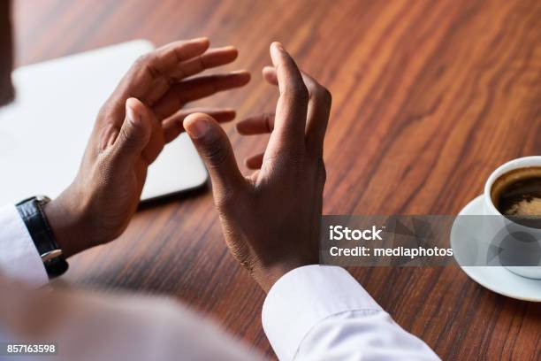 Man Gesturing While Explaining Stock Photo - Download Image Now - Discussion, Talking, Gesturing