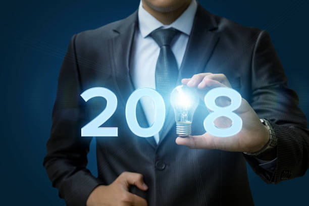 istock 2018 Ideas concepts with businessman hand holding light bulb. 857164316