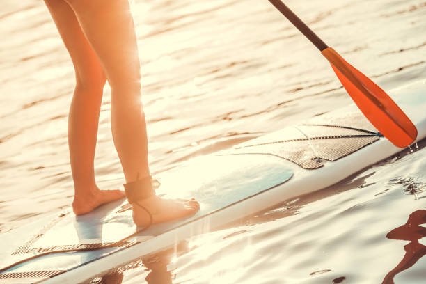 istock Woman standup paddleboarding 857165398