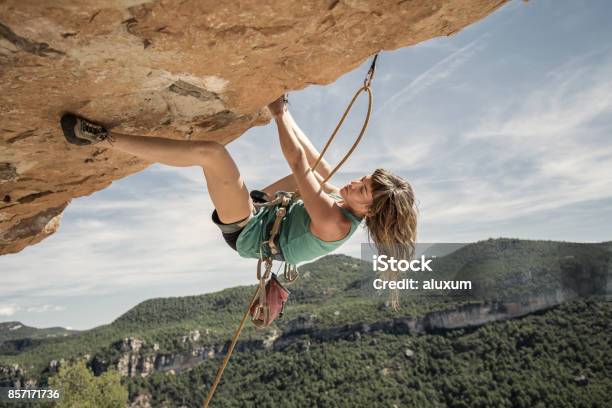 Young Woman Practicing Rock Climbing Stock Photo - Download Image Now - Climbing, Rock Climbing, Women