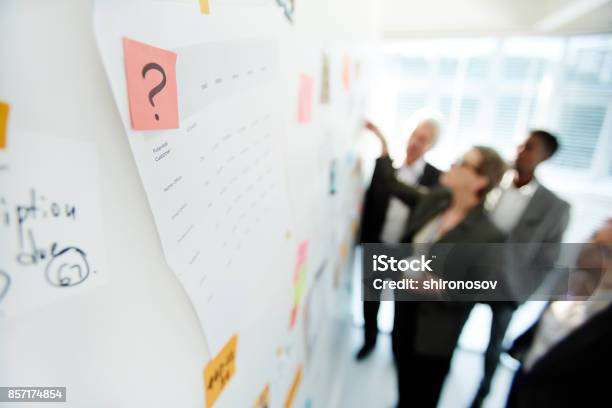 Productive Project Discussion Of Colleagues Stock Photo - Download Image Now - Chalkboard - Visual Aid, Meeting, Detective