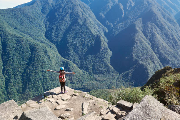 istock Woman stand on mountain cliff 857176148