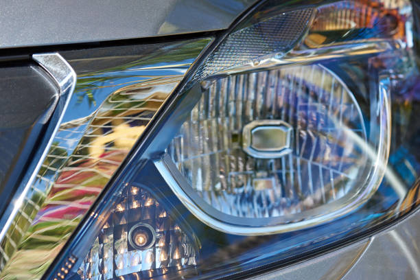 istock Closeup of lamp in car headlight 857178274